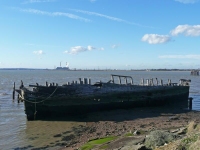 An old boat rotting away on the River Thames