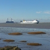 A ship making its way down the River Thames