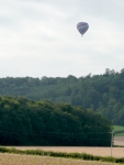 A balloon in the morning haze, floating above the South Downs