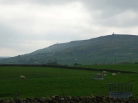 The view back over Cowling to the monuments on Earl Crag at the start of day 5