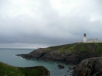 Lighthouse (and foghorn) at Black Head, before the path heads East