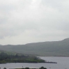 2 people fishing in the pouring rain at Loch Dee